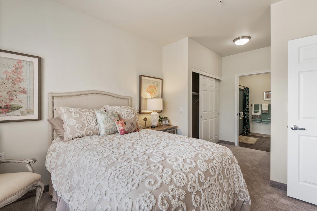 A furnished bedroom in a Osprey Heights apartment